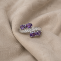 Ring mit lila Steingruppen und Zirkonia-Band
